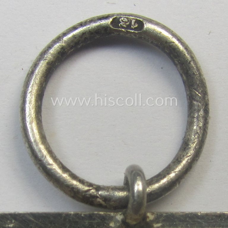 'EK II. Klasse' being a maker- (ie. '13'-) marked example that comes together with its original- and never-mounted ribbon (ie. 'Bandabschnitt') as was produced by the maker (ie. 'Hersteller'): 'Gustav Brehmer'