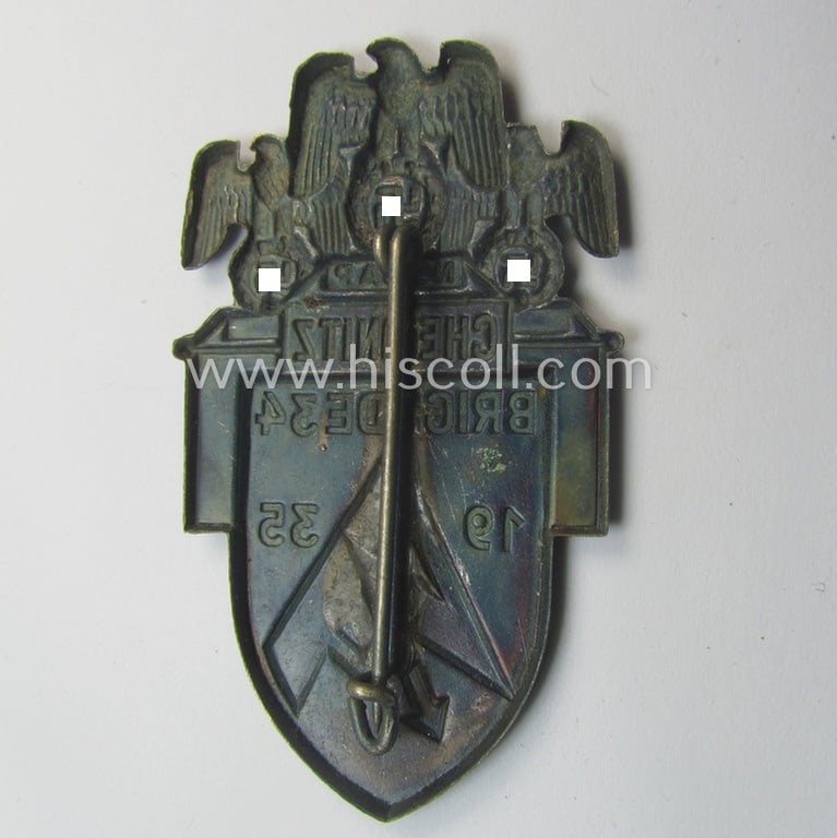 Commemorative, silverish- (ie. red-) coloured N.S.D.A.P.- (ie. 'SA- o. Sturmabteilungen'-) related 'tinnie' being a non-maker-marked example showing 3 detailed eagle-devices, SA-logo- and text: 'Chemnitz - Brigade 34 - 1935'