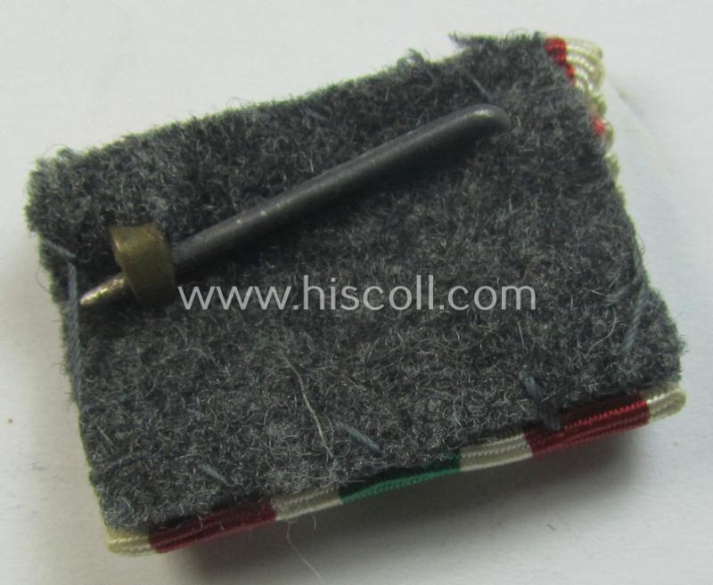 Single-pieced - and actually scarcely found! - WH (Heeres, LW etc.) ribbon-bar (ie. 'Band- o. Feldspange') showing the ribbon for a WH Memel- (ie. 'Memelland'-) 'Anschluss'- (ie. occupation-) medal: '22 März 1939'