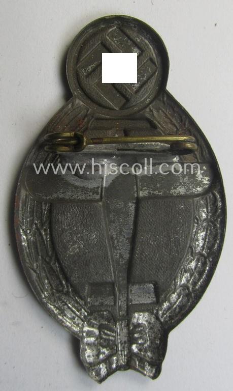 Commemorative, 'hollow-back'- and/or greyish-silver-toned, so-called: 'Flieger'-related day-badge (ie. 'tinnie') being a non-maker-marked example showing an illustration of a swastika and plane