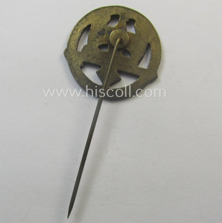 Golden-bronze-toned, so-called: 'Nationalsozialistischer Soldatenring' (ie. 'NSR') membership-badge (or: 'Mitgliedsabzeichen') being a maker- (ie. 'F. Petzl'-) marked example that comes mounted onto its long-sized pin