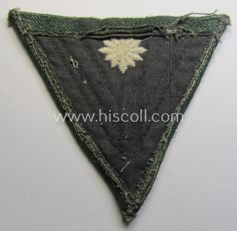 WH (Heeres) 'Armwinkel' (or: arm-chevron) as executed on typical field-grey-coloured (and HBT-type!) linnen as was specifically intended for usage by a soldier with the (unusually encountered!) rank of: 'Stabsgefreiter'