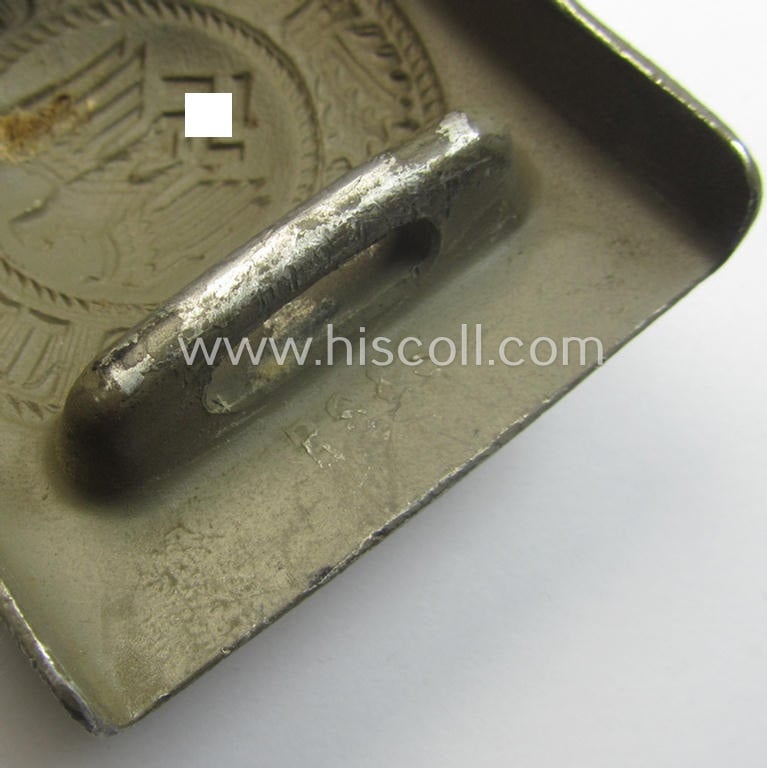 WH (Heeres) 'standard-pattern', field-grey-toned- and aluminium-based belt-buckle being a maker- (ie. 'R. Sieper & Söhne'-) marked- and/or: '1938'-dated example that comes mounted onto its leather-based tab