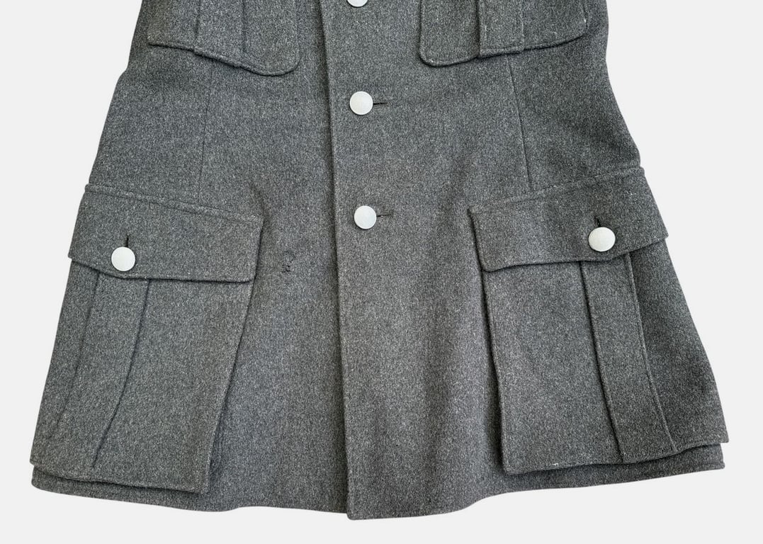 DRK (Deutsches Rotes Kreuz)  Vorhelfer service tunic with original insignia and armband.