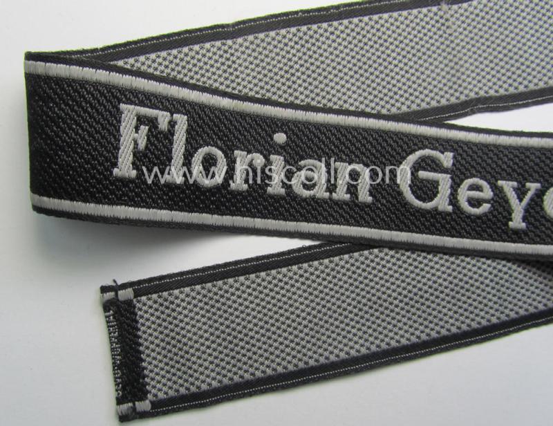 Waffen-SS, 1943-pattern cuff-title (ie. 'Ärmelstreifen') depicting the ('BeVo') machine-woven, Latin script text in silverish-grey linnen as was intended for a member of the: '8. SS-Kavallerie-Division “Florian Geyer”