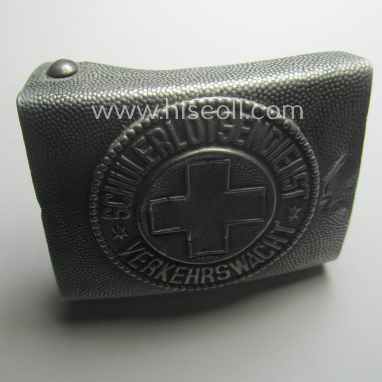 Never before seen, TR-period aluminium-based and youth-related belt-buckle being a non-maker-marked example that was worn by a member of the: 'Schülerlotsendienst - Verkehrswacht'