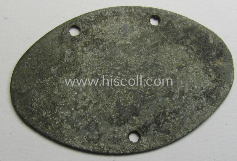 Mid-war- (albeit 'standard-issue'-) pattern, WH (Kriegsmarine) typical zinc- (ie. 'Feinzink'-) based- and greyish-silver-toned ID-disc (ie. 'Erkennungsmarke') bearing the engraved coded numeral (ie. text) that reads: 'Kriegsmarine 129387/42'