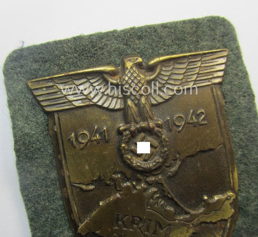 Attractive - and I deem issued but simply never used! - WH (Heeres ie. Waffen-SS) 'Krim'-campaign-shield (as was produced by a by me unidentified maker) and that comes in a wonderful and/or fully untouched, condition