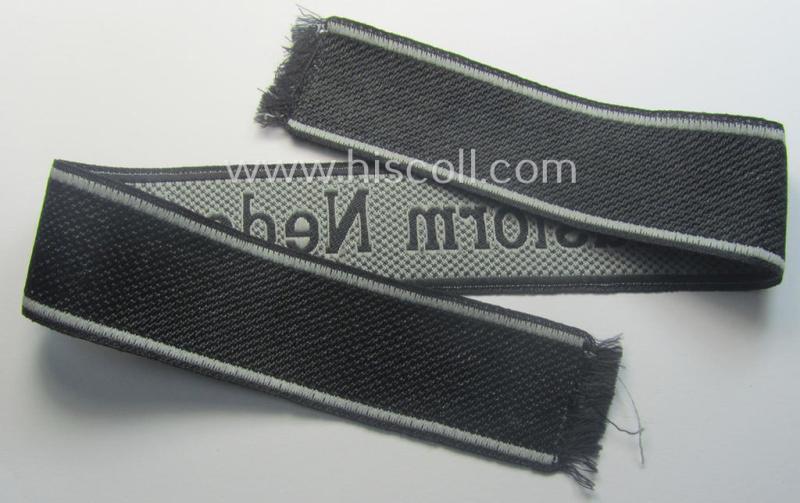 Waffen-SS, 1943/44 pattern cuff-title (ie. 'Ärmelstreifen') depicting the machine-woven Latin script text in silver-grey linnen as was intended for a member of the: '34. SS-Freiwilligen-Grenadier-Division': “Landstorm Nederland”