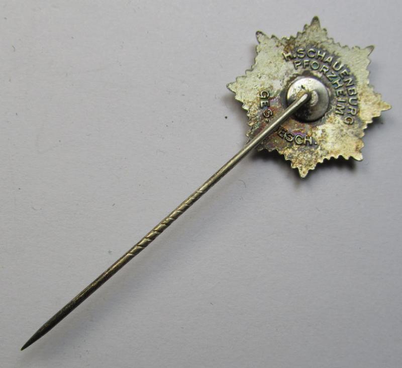 Semi-enamelled RLB- (ie. 'Reichluftschützbund') 'Zivilabzeichen' or: civil-attire badge (of the first pattern) that is neatly maker- (ie. 'H.Schauenburg - Pforzheim'-) marked and bearing a patent-pending- (ie. 'Ges.Gesch.'-) marking on its ba...