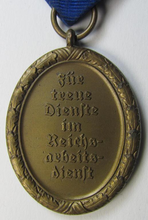 Attractive example of a: RAD (ie. 'Reichsarbeitsdienst') so-called: 'Dienstauszeichnung 4. Stufe für Männer' as was intended for 4 years loyal-service and that comes mounted onto its period piece of ribbon (ie. 'Bandabschnitt')