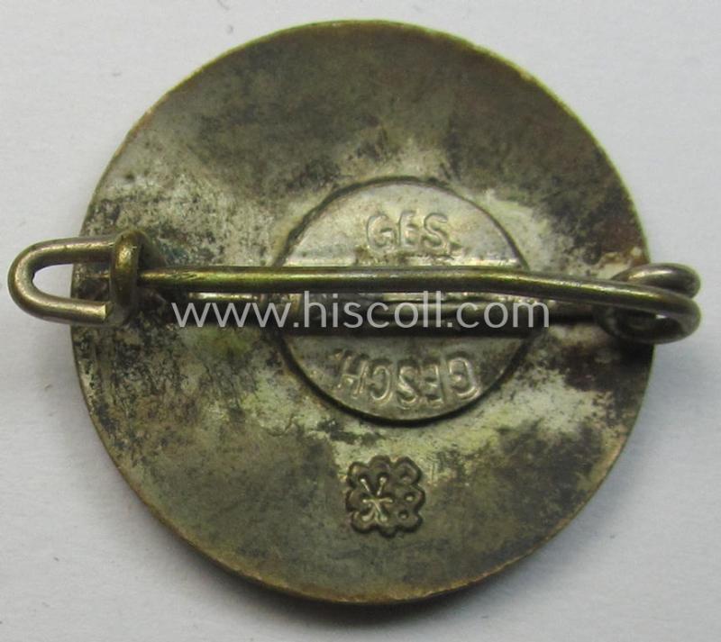 Smaller-sized- and early-period, bright-red-coloured 'N.S.D.A.P.'-membership-pin- ie. party-badge (or: 'Parteiabzeichen') which is maker-marked on its back with a (by me) unidentified makers'-designation (ie. logo)