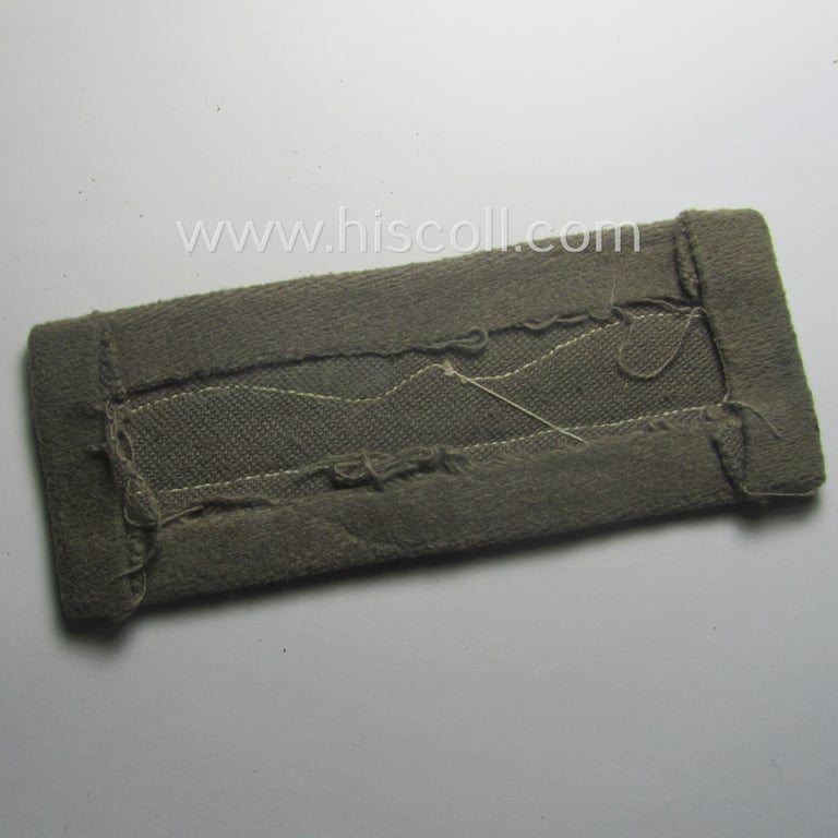Single, WH (Luftwaffe) greyish-blue-coloured, officers'-type rank-patch (aka 'moustache'), as was intended for usage by a commissioned officer with the rank of: 'Leutnant' (ie. lieutnant)