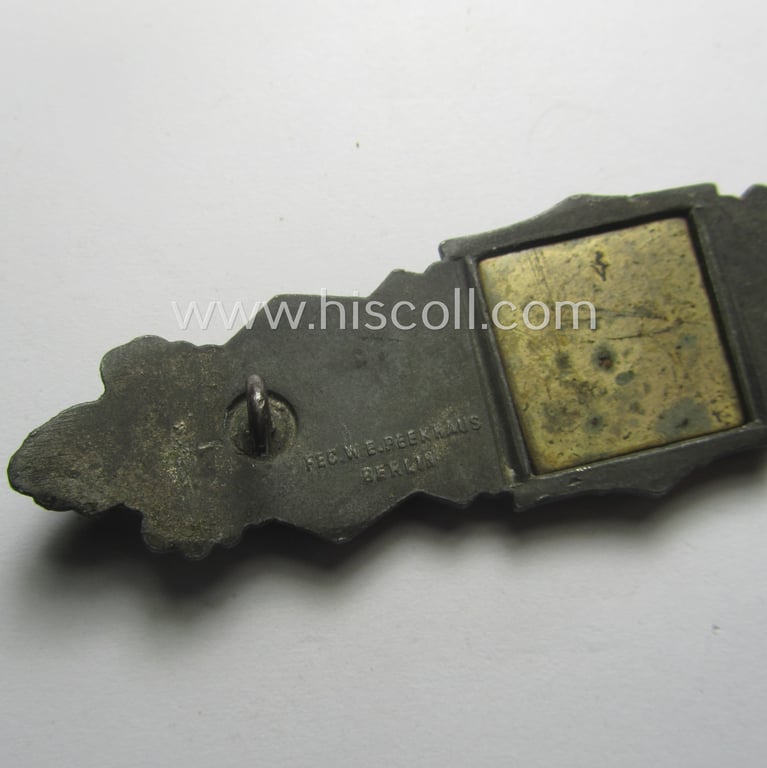 'Nahkampfspange in Bronze' (or: bronze-class close-combat clasp ie. CCC) being a (typical) maker-marked- and/or minimally converse-shaped specimen as was produced by the maker- (ie. 'Hersteller') 'Friedrich Linden' (ie. 'FLL')
