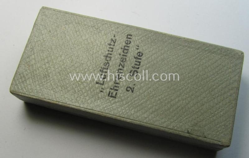 Light-weight (ie. typical aluminium-based) medal as was intended for air-raid wardens 2nd. class (or: 'Luftschutz-Ehrenzeichen 2. Stufe') that comes stored in its period, dove-grey-coloured etui