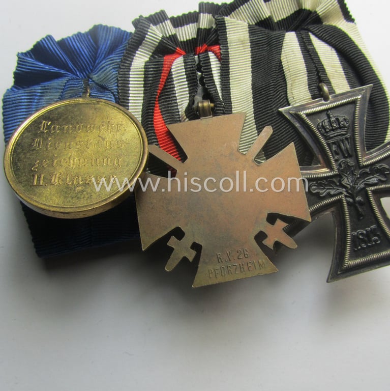 3-pieced, 'WWI'-period medal-bar (ie. 'Ordenspange') resp. depicting an: 'EK II.Kl.', a: 'FKK 1914-18 mit Schwn.' and a: 'Landwehr DA 2. Kl. 1913' that comes with its accompanying miniature 'Feldspange'