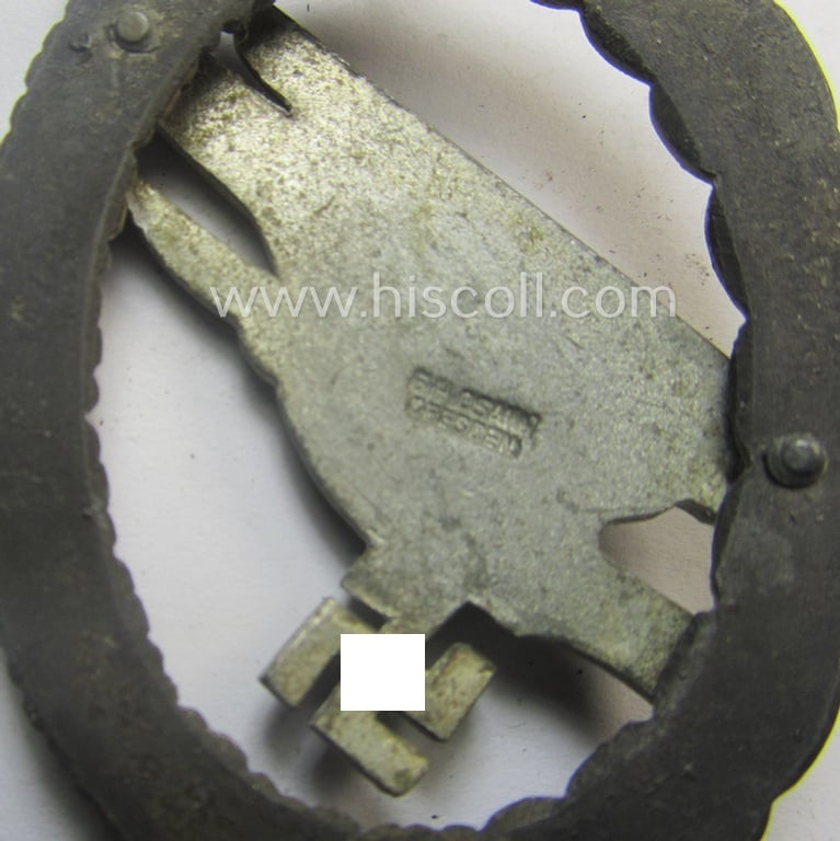 Zinc- (ie. 'Feinzink'-) based version of a WH (Luftwaffe) 'Fallschirmschützen-Abzeichen' (being a maker-marked, 'Type D'-pattern example as was produced by the 'G.H. Osang'-company)