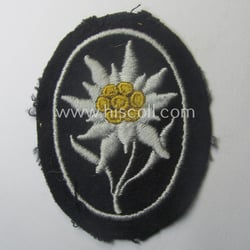 Waffen-SS-pattern, black-coloured sleeve-insignia (ie. 'Ärmelabzeichen') depicting an: 'Edelweiss'-flower...