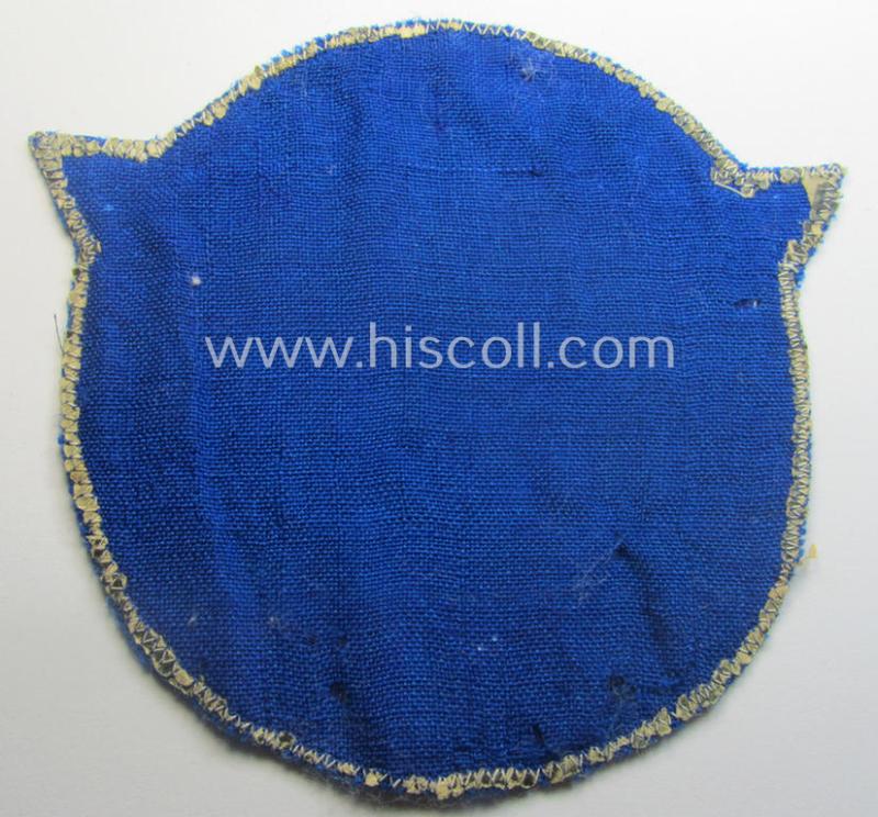 Very unusual, darker-blue-coloured: N.S.F.K.- (or: 'National Socialistisches Flieger Korps') sports-shirt breast-eagle for 'förderende Mitglieder' being a nicely 'BeVo'-woven- (and carefully 'cut-out'!) example
