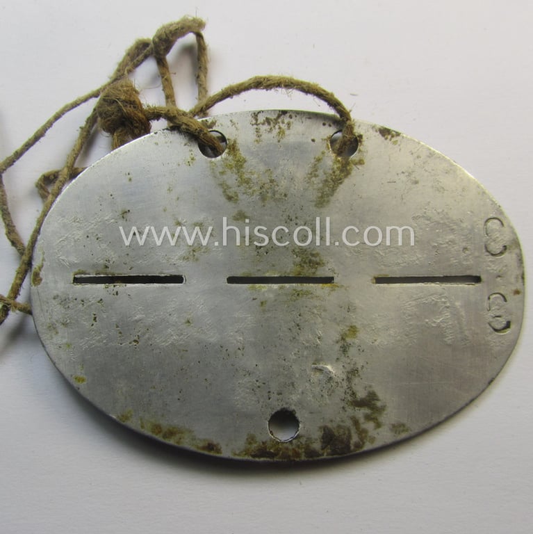 Aluminium-based, WH (Luftwaffe) ie. 'LW-Flak-Artillerie'-related ID-disc (ie. 'Erkennungsmarke') bearing the stamped unit-designation: '3./Flak Ers.Abt. 25' and that comes mounted onto its cord as issued- and/or worn