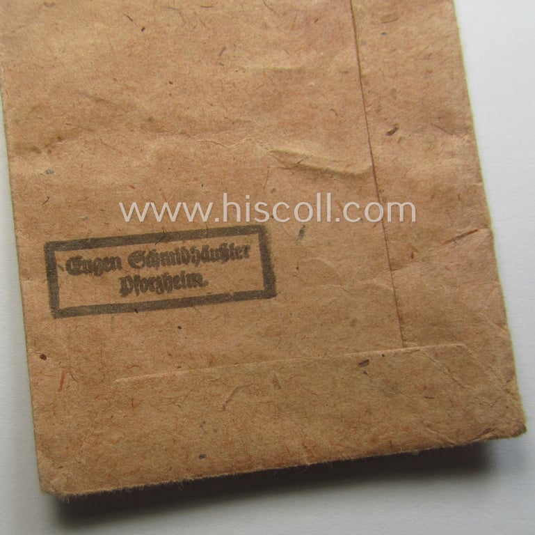 Empty 'Zellstoff'-based pouch as was intended for a medal: 'Winterschlacht im Osten 1941/42' as was produced by the company: 'Eugen Schmidthaussler - Pforzheim' (ie. 'Hersteller 28')