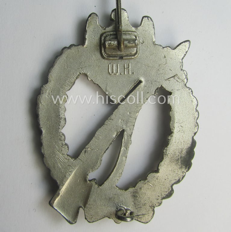 'Infanterie Sturmabzeichen in Silber' being a maker- (ie. 'W.H.'-) marked and/or quite converse, 'solid-back' example by the Austrian-based maker: 'Wilhelm Hobacher' as was executed in bright silver-coloured, zinc-based metal