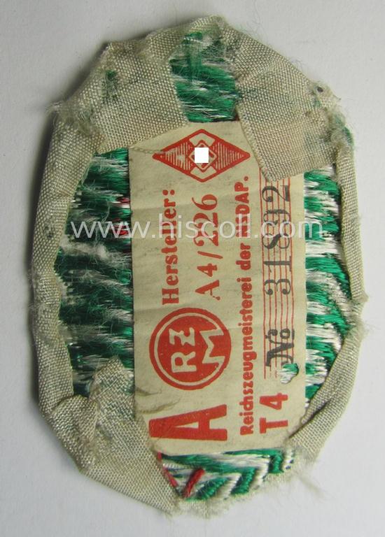 HJ/BDM (ie. 'Hitlerjugend'/'Bund Deutscher Mädel') trade- ie. specialist-armbadge as executed in neat 'BeVo'-weave pattern as was specifically intended for a: 'Gefolgschaftsfeldscher' that still retains its 'RzM'-etiket