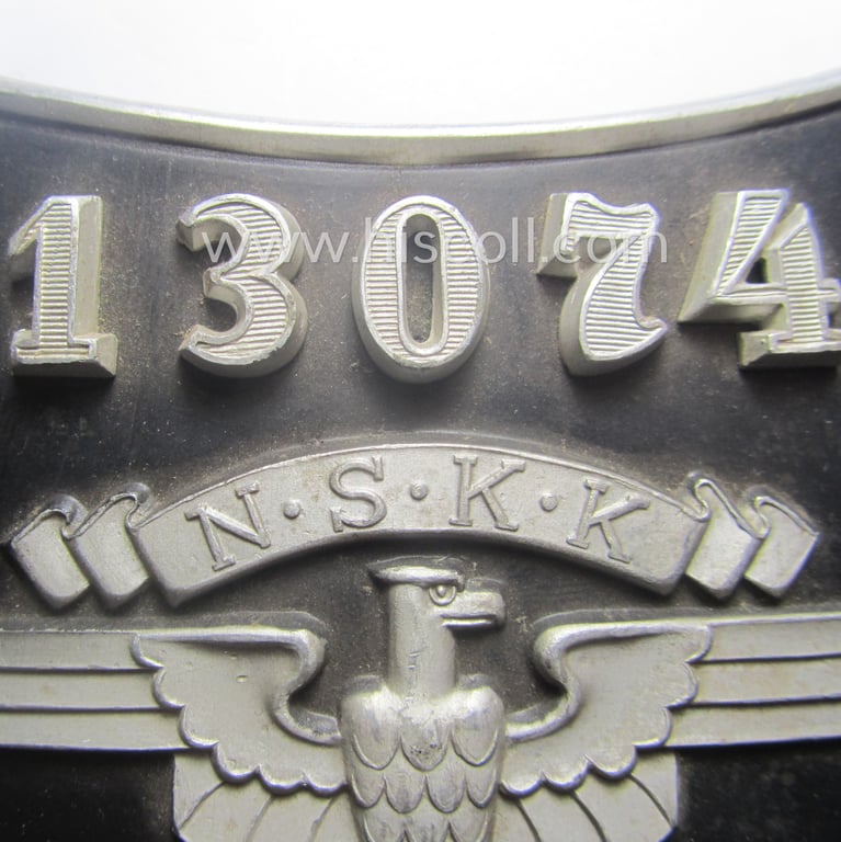 Superb - quite rarely seen and very detailed! - aluminium-based, N.S.K.K.-related gorget (ie. 'Brustschild o. Ringkragen') depicting the typical N.S.K.K.-eagle-device, unique numeral: '13074' and text that reads: 'N.S.K.K. Verkehrserziehungsdienst'
