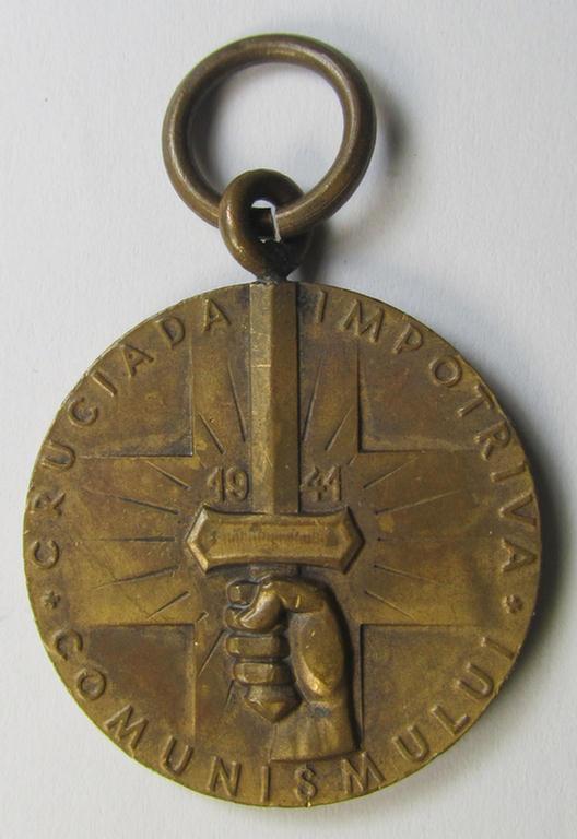 Romanian medal: 'Kreuzzug gegen den Kommunismus' (or in Romanian language: 'Medalia - Crusiada Impotriva Communismului') that comes together with its original (and never confectioned- ie. 'virtually mint') ribbon as issued