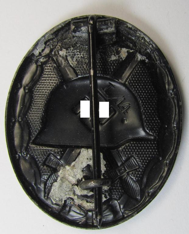 Truly rarely found - and neatly maker- (ie. 'L/14'-) marked! - example of a black-class wound-badge (or: 'Verwundeten-Abzeichen in Schwarz') as was produced by the (unusually seen!) maker (ie. 'Hersteller'): 'Friedrich Orth' based in Wien