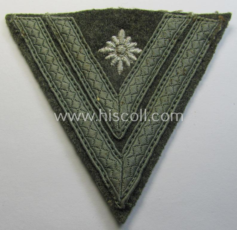 Attractive, WH (Heeres) 'Armwinkel' (or: arm-chevron) as executed on typical field-grey-coloured wool as was specifically intended for usage by a soldier with the (unusually encountered!) rank of: 'Stabsgefreiter'