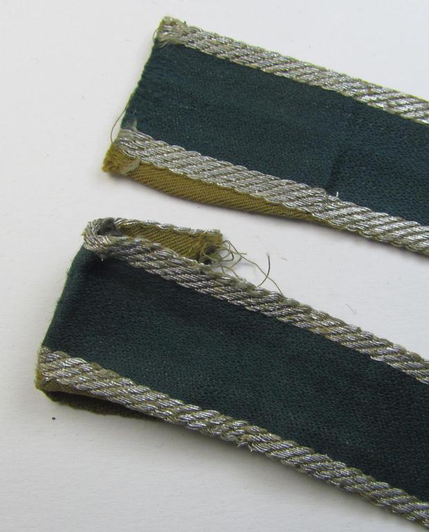 Superb, 'BeVo'-like cuff-title (ie. 'Ärmelstreifen') entitled: 'Afrikakorps' being a with certainty issued and truly worn example that comes in an overall nice- (ie. non-shortened- and most certainly once tunic-attached-), condition