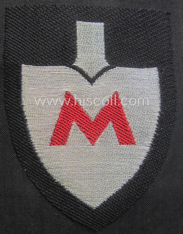 Officers'-pattern, so-called: RAD (ie. 'Reichsarbeitsdienst') sleeve-badge (or: 'Dienststellenabzeichen') bearing the specialist-designation: 'M' (or: 'Hauptmeldebeambter')