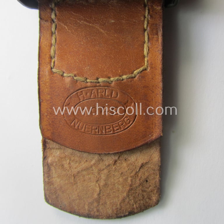 Superb - and 'virtually mint'! - WH (Heeres) field-grey-toned- and steel-based belt-buckle being a maker- (ie. 'H.A. 42'-) marked example that comes mounted onto its: 'H. Arld - Nürnberg'-marked and/or: '1942'-dated tab