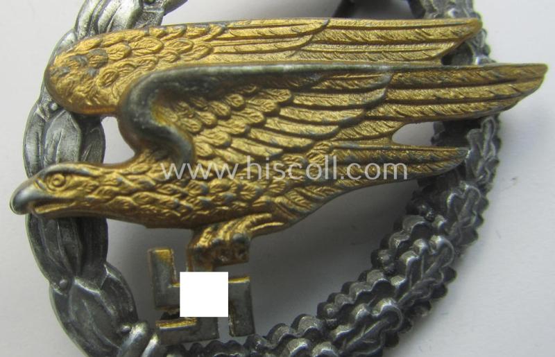 WH (Luftwaffe) 'Fallschirmschützen-Abzeichen' (or: paratroopers-jumpbadge) being a neatly maker- (ie. 'B&N - L'-) marked- and typical zinc- (ie. 'Feinzink'-) based example as was produced by the maker: 'Berg u. Nolte'