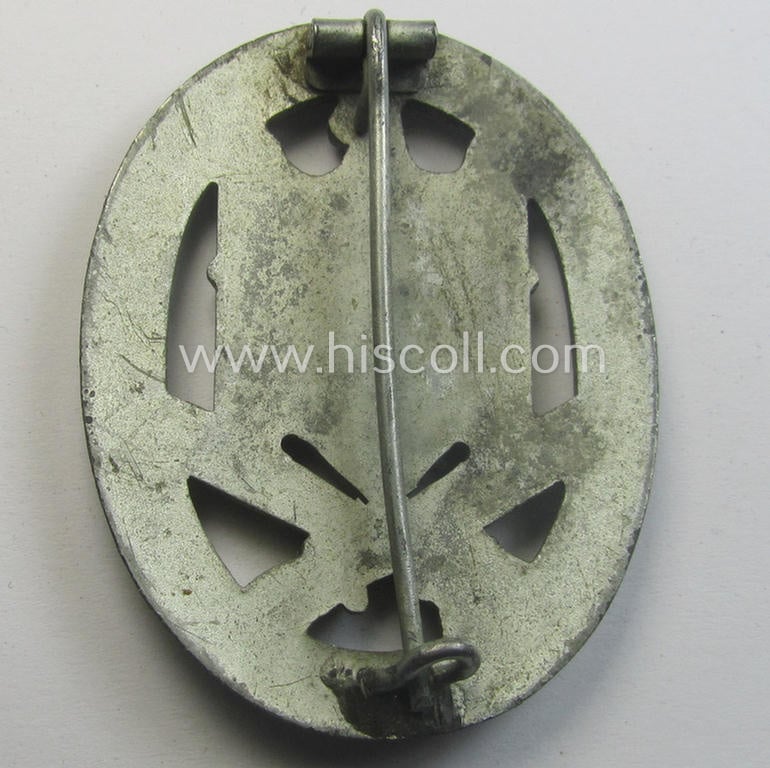 'Allgemeines Sturmabzeichen' (or: General Assault Badge ie. GAB) being a typical unmarked, zinc-based- (ie. 'Feinzink'-) and/or: 'semi-hollow-back'-version as was (I deem) produced by the: 'Rudolf Karneth'-company