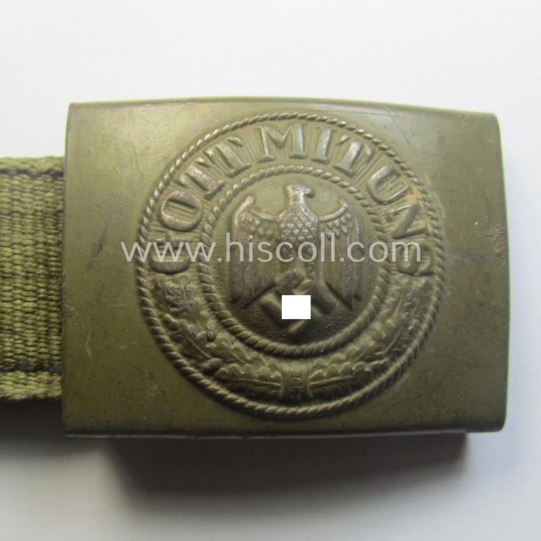 WH (Heeres) 'tropical-issued' belt-buckle being a non-maker-marked, field-grey-coloured example that comes mounted onto its original, greenish-coloured- (and/or: 'webbing'-based-) tab