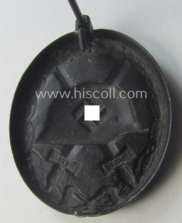 Maker- (ie. '63'-) marked example of a black-class wound-badge (or: 'Verwundeten-Abzeichen in Schwarz') being an example that was produced by the maker (ie. 'Hersteller') named: 'F.J. Klast & Söhne'