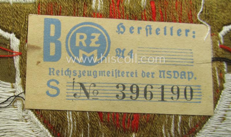 Breast-badge as executed in 'BeVo-weave' pattern as was intended for members within the 'N.S.D.A.P. Reichsautozug' (or: 'RaZ') still retaining its period, paper-based 'RzM'-etiket