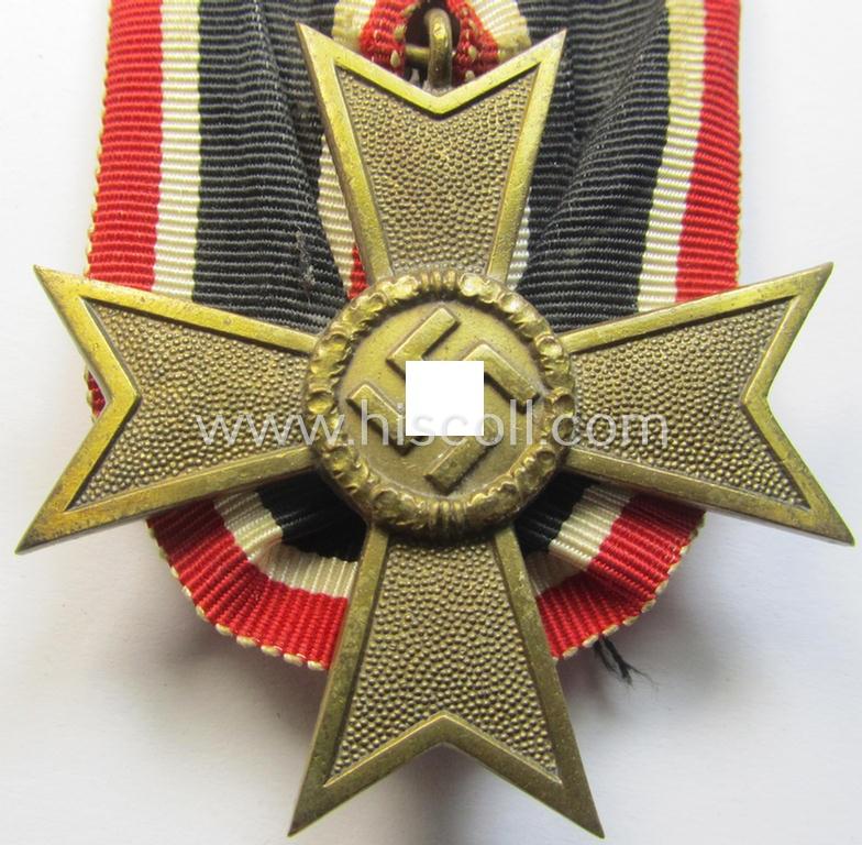 Attractive - and truly unusually seen! - golden-bronze-toned so-called: 'Einzelspange' showing a: 'Kriegsverdienstkreuz II. Klasse ohne Schw.' (or: war-merits' cross 2nd class with swords) being a very detailed- and/or 'Buntmetall'-based speci...