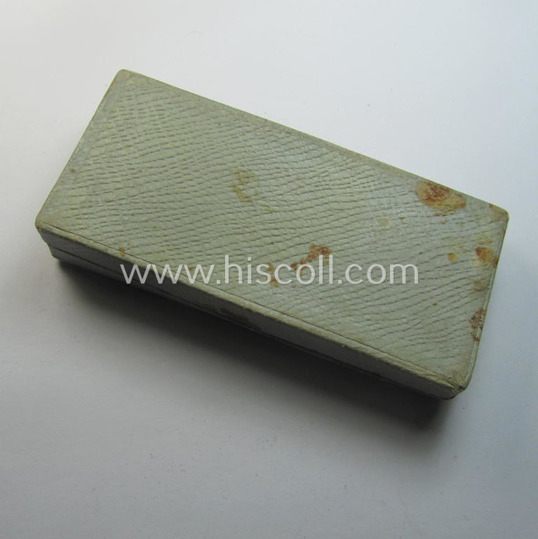 Light-weight (ie. typical aluminium-based) medal as was intended for air-raid wardens 2nd. class (or: 'Luftschutz-Ehrenzeichen 2. Stufe') that comes stored in its period, dove-grey-coloured etui