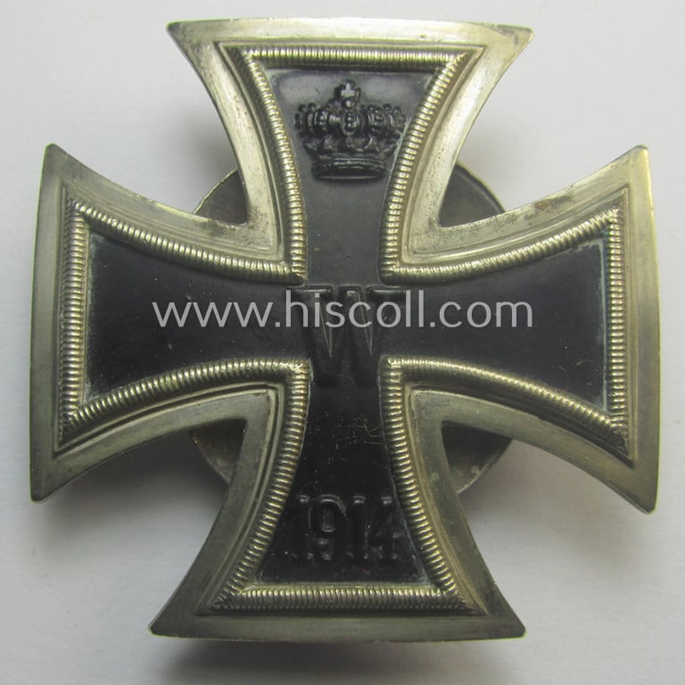 WWI-period Iron Cross 1st class (or: 'EK 1. Klasse') being a typical non-maker-marked example (by the 'C.E. Juncker'-company!) that comes mounted onto its (unusual!) and functional 'screw-back'- (ie. 'an der Schraube'-) set-up