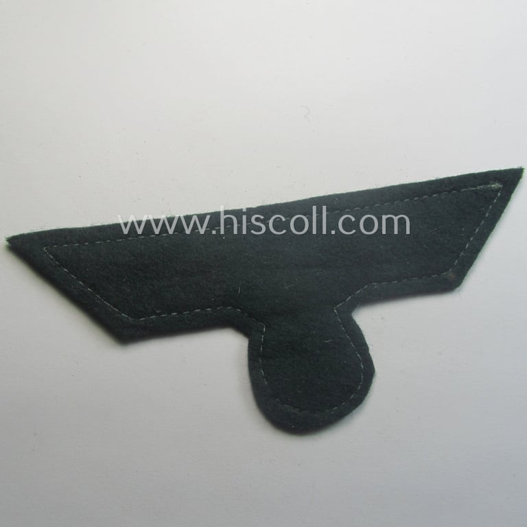 WH (Heeres) breast-eagle as executed in 'BeVo'-type, 'flat-wire'-weave-pattern and pre-mounted on darker-green-coloured wool as was intended for usage by soldiers (ie. NCOs) on their dress-tunics (ie. 'Waffenröcke')