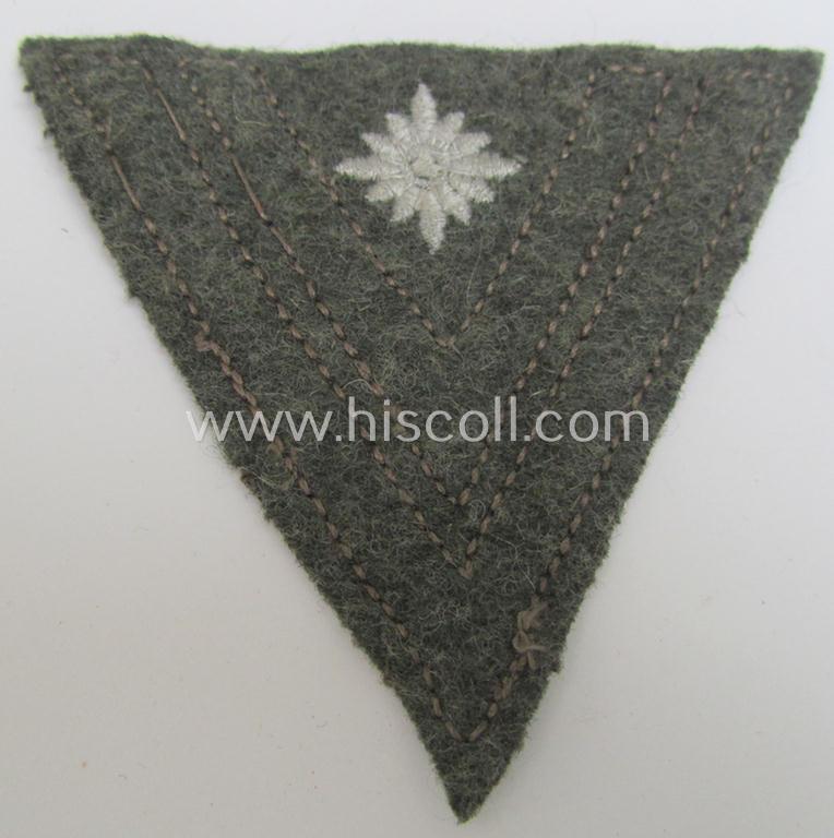WH (Heeres) 'Armwinkel' (or: arm-chevron) as executed on typical field-grey-coloured wool as was specifically intended for usage by a soldier with the (unusually seen!) rank of: 'Stabsgefreiter'