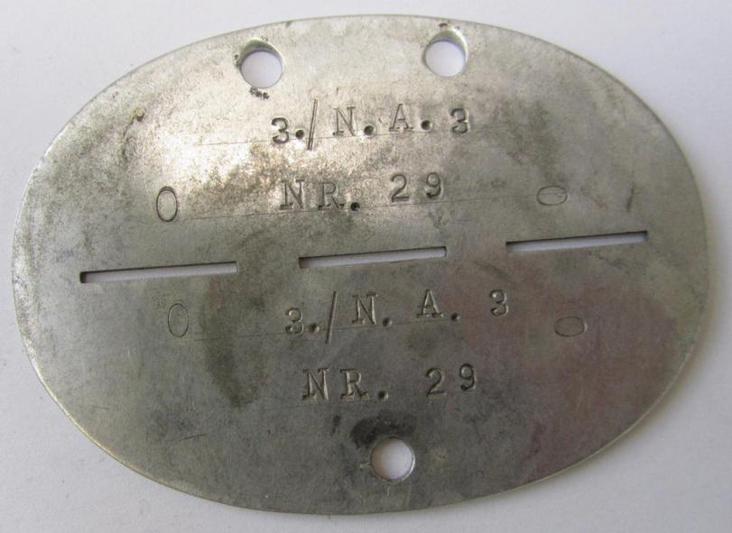 Unusual insignia-grouping, comprising of a matching pair of WH (Heeres) officers'-type shoulderboards as used by an: 'Oberleutnant eines Nachrichten-Rgts.' that comes with its accompanying ID-disc (bearing the stamped unit-designation: '3.N.A.3'...