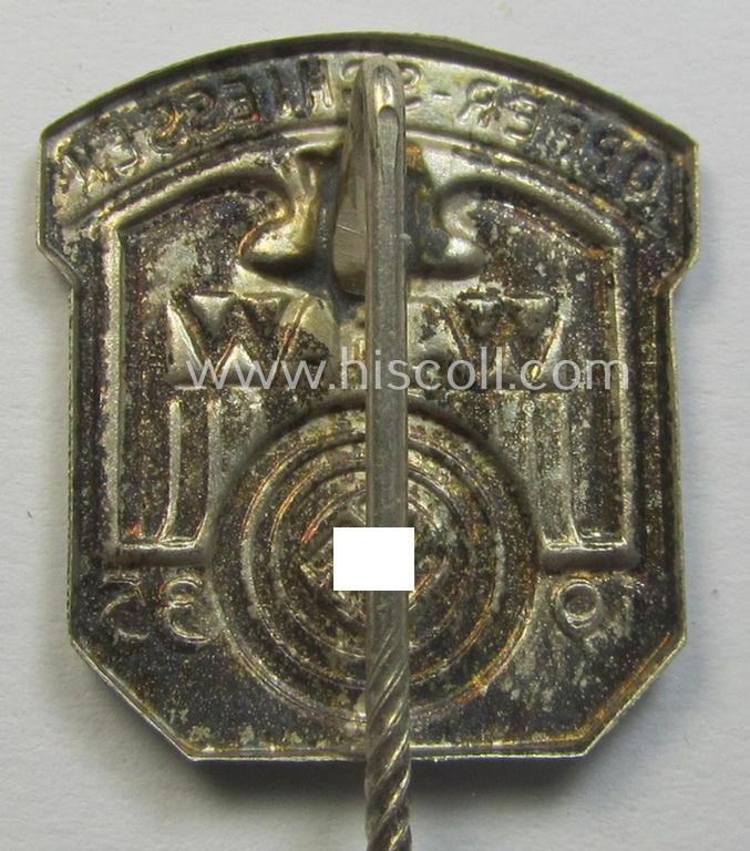 Attractive - and surely unusually found! - WHW- (ie. 'Winterhilfswerke'-) related commemorative shooting-contest lapel-pin entitled: 'Opfer-Schiessen - W.H.W. - 1935'