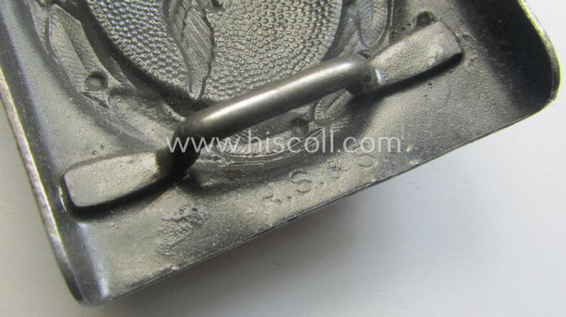 WH (Luftwaffe) darker-blue-coloured- and/or steel-based belt-buckle, being a neatly maker- (ie. 'R. Sieper & Söhne'-) marked and/or: '1942'-dated example that comes mounted onto its period, natural-coloured and/or leather-based tab