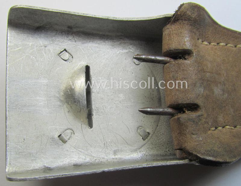 Bright-silver-coloured- and/or aluminium-based TR-period, fire-brigade- (ie. 'Feuerwehr'-) belt-buckle being a non-marked example that comes mounted onto its 'typically-shaped', leather-based tab