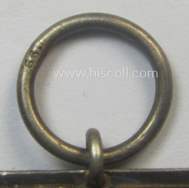 Fully matching 'EK II. Klasse'-set comprising of a neatly-maker- (ie. '66'-) marked specimen that comes with its ribbon (ie. 'Bandabschnitt') and 'Zellstoff'-based pouch as was produced by the company: 'Friedrich Keller' (ie. 'Hersteller 66')