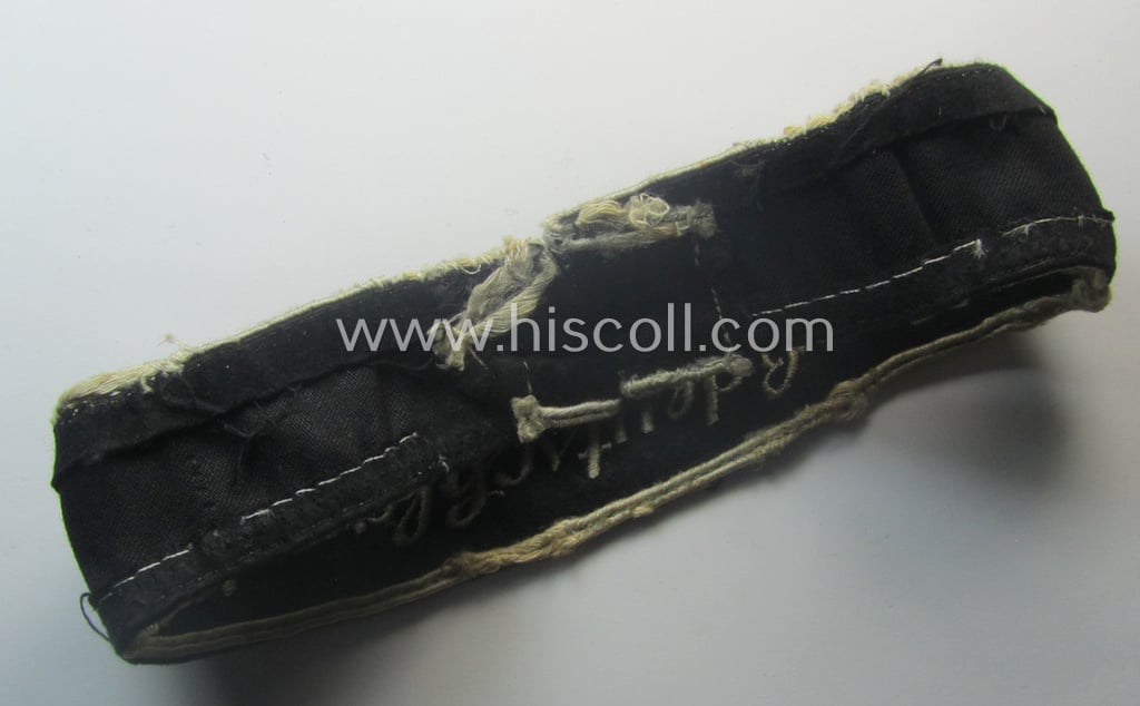 Truly used- and/or worn example of a WH (Heeres) cuff-title ie. armband (ie. 'Ärmelstreifen') entitled: 'Grossdeutschland' (being a neatly machine-embroidered example of the third pattern that was specifically intended for EM- ie. NCO-usage)